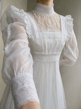 Victorian-Inspired White Lace Bridal Gown with High Neck and Sheer Puff Sleeves